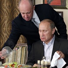 FILE Yevgeny Prigozhin, top, serves food to then-Russian Prime Minister Vladimir Putin at Prigozhin's restaurant outside Moscow, Russia on Nov. 11, 2011. Prigozhin, the owner of the Wagner private military contractor who called for an armed rebellion aimed at ousting Russia's defense minister has confirmed in a video that he and his troops have reached Rostov-on-Don. 