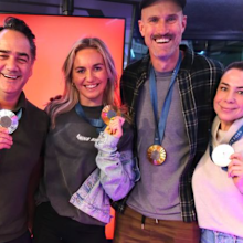 Radio hosts Fitzy, Wippa and Kate with swimming champion Ariane Titmus and her Paris 2024 gold medals