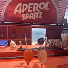 Enjoying an Aperol spritz while on vacation.