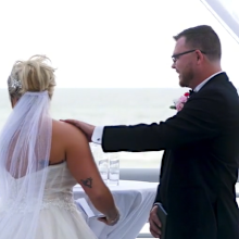 Bride and groom interrupted by bird at wedding