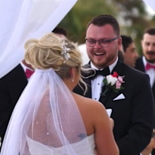 Bride and groom interrupted by bird at wedding