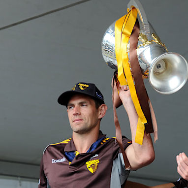 Hawks captain Luke Hodge holds aloft the cup.