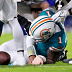 Tua Tagovailoa of the Miami Dolphins lays on the ground.