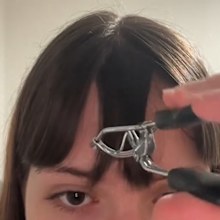 TikTok fringe hack using eyelash curler