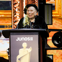 HAMILTON, ONTARIO - MARCH 29: Joni Mitchell accepts the Lifetime Achievement award onstage during the 2026 JUNO Awards at TD Coliseum on March 29, 2026 in Hamilton, Ontario. (Photo by Cindy Ord/Getty Images)