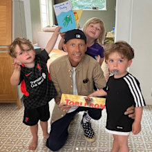 jonnie irwin holding a chocolate bar with his children for father's day
