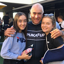 Wayne Schwass with his twin daughters who are 17.