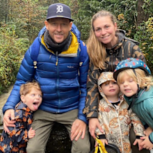 jonnie irwin with his wife and children during a hike outdoors