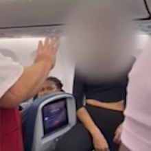 woman tantrum on plane dog on lap