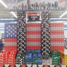 A Walmart display showing cases of Coca-Cola arranged to look like the Twin Towers. (Twitter/online_shawn)