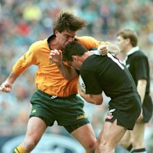 Michael Brial attacks Frank Bunce.