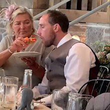 Drunk groom is hand-fed by mother-in-law at wedding