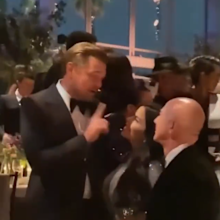 Leonardo DiCaprio speaking with Lauren Sanchez and Amazon billionaire Jeff Bezos
