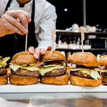 chef preparing burgers at restaurant