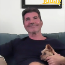 The dog barked during the interview so Cowell picked her up.