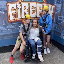 Ashlee Morton in her wheelchair with her two children.
