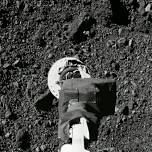 This Aug. 11, 2020 photo shows the sampling arm of the OSIRIS-REx spacecraft during a rehearsal for an approach to the "Nightingale" sample site on the surface of the asteroid Bennu. (NASA/Goddard/University of Arizona via AP)