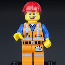 Tambov, Russian Federation - February 10, 2014 LEGO Hard Hat Emmet minifigure on black background. LEGO Movie series. Studio shot. LEGO is a popular line of construction toys manufactured by the Lego Group (Billund, Denmark).