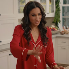 Meghan, the Duchess of Sussex, wearing red monogrammed pyjamas in With Love, Meghan: Holiday Celebration.