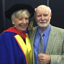 Maggie Beer with her husband Colin. Maggie is wearing university robes.