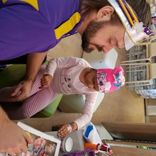In the starlight room with Captain Starlight choosing face paint.