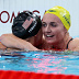 NANTERRE, FRANCE - AUGUST 03: Katie Ledecky of Team United States and Ariarne Titmus of Team Australia celebrate after winning gold and silver in the Women's 800m Freestyle Final on day eight of the Olympic Games Paris 2024 at Paris La Defense Arena on August 03, 2024 in Nanterre, France. (Photo by Quinn Rooney/Getty Images)