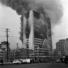 The blaze was spread through uncontained stairwells.