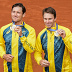 Gold medalists Matthew Ebden and John Peers of Australia celebrate on the podium after defeating Austin Krajicek and Rajeev Ram of the United States in the men's doubles gold medal match at the Roland Garros stadium, at the 2024 Summer Olympics, Saturday, Aug. 3, 2024, in Paris, France. (AP Photo/Manu Fernandez)