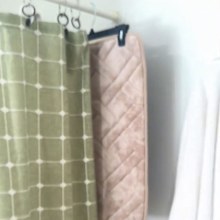 Lauren's bath mat drying hack using a coat hanger