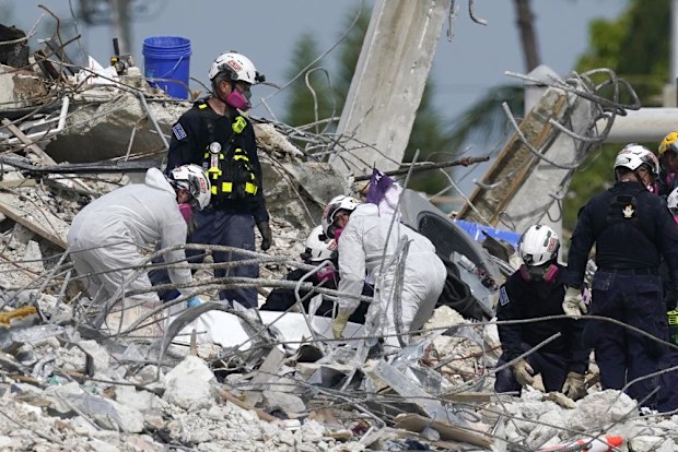 Storm threat hangs over renewed search at Florida condo site