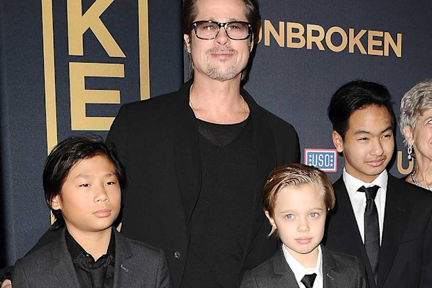 Brad Pitt, Pax Jolie-Pitt, Shiloh Jolie-Pitt and Maddox Jolie-Pitt in 2014.