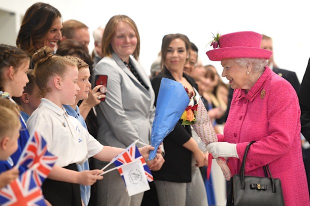 The Queen meets children in Cambridge.