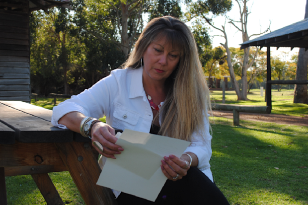 Michelle reading letter