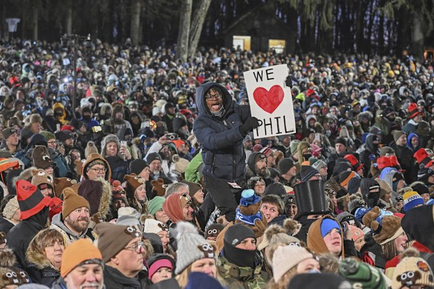 The crowd watches the festivities while waiting for Punxsutawney Phil, the weather prognosticating groundhog
