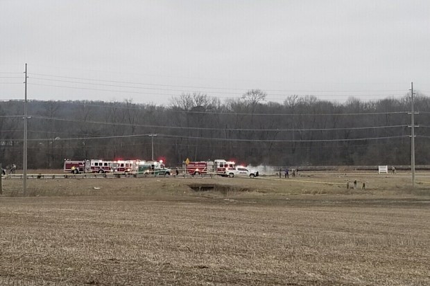 Police and fire personnel respond to a Black Hawk helicopter crash Wednesday, Feb. 15, 2023, in the unincorporated community of Harvest, Ala. U.S. military officials say two people on board the helicopter, which was from the Tennessee National Guard, were killed. 