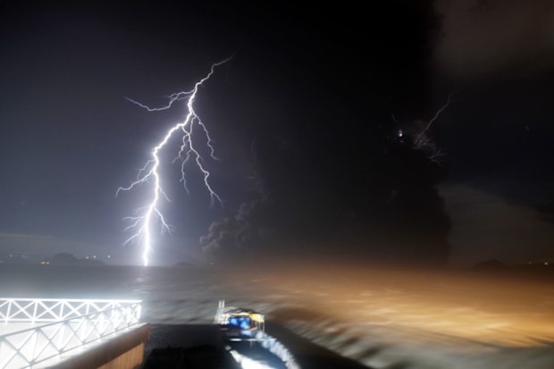 As tremors shook the area, volcanic lightning flickered in the column of steam and ash.