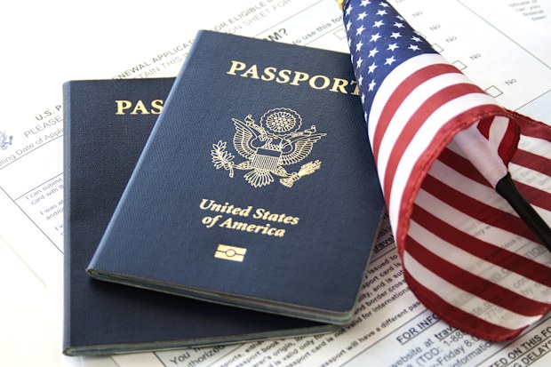 US Passports with flag and renewal forms