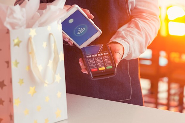 Christmas shopping paying with an iPhone