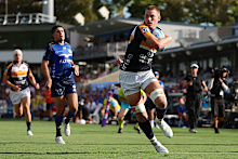 Charlie Cale of the Brumbies crosses for a try during the round one Super Rugby match.