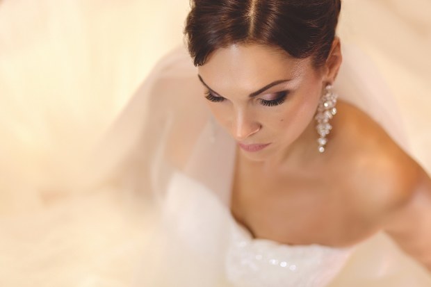 Bride sitting down ahead of wedding