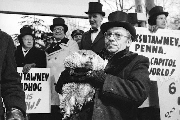 Jim Means holds up Punxsutawney Phil 
