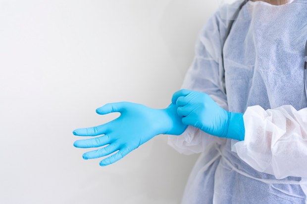 The cameraman wore PPE similar to hospital staff.