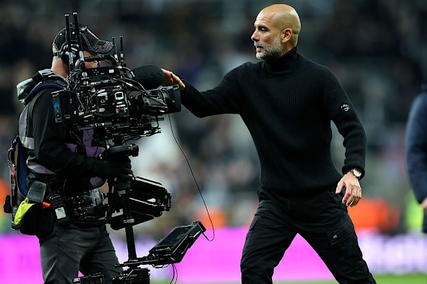Pep Guardiola complains to a TV cameraman after the Premier League match.