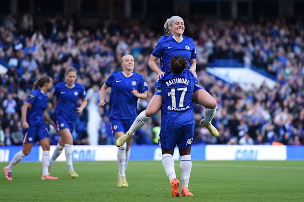Ellie Carpenter of Chelsea celebrates with teammate Sandy Baltimore after scoring.