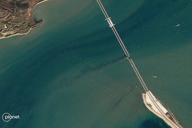This Planet Labs satellite image shows a plume of smoke after an explosion caused the partial collapse of a bridge linking the Crimean Peninsula with Russia, damaging a key supply artery for the Kremlin's faltering war effort in southern Ukraine, Saturday, Oct. 8, 2022.