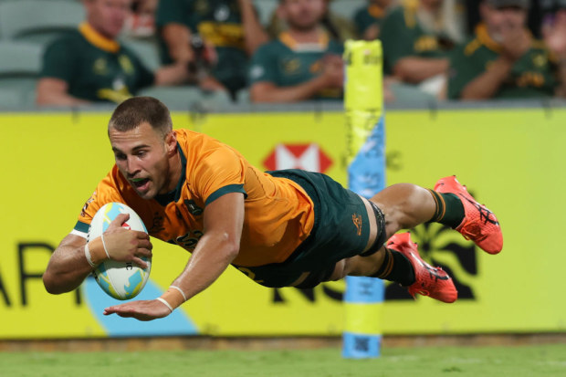 Nathan Lawson of Australia  scores a try.