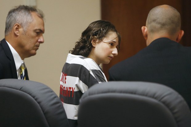 Gypsy Rose Blanchard speaks with her attorney's Mike Stanfield, right, and Clate Baker before her court appearance, July 5, 2016, in Springfield, Mo.  