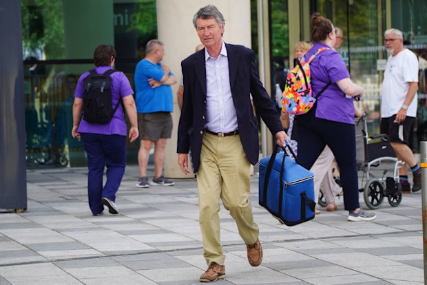 Vice Admiral Sir Tim Laurence leaves Southmead Hospital in Bristol where the Princess Royal is being treated 