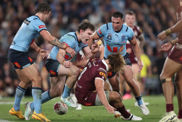 Liam Martin of the Blues reacts after tackling Reuben Cotter of the Maroons.