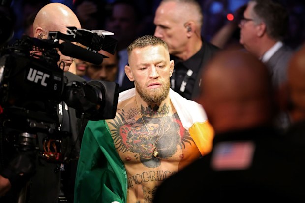 Conor McGregor of Ireland walks through the arena.